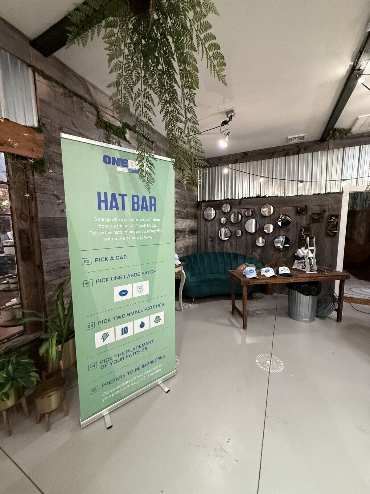 Live mobile embroidery station stitching a cap on site at an event