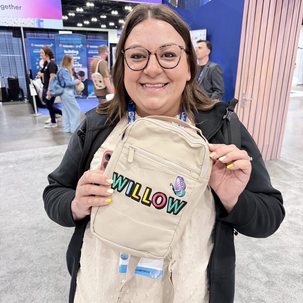Embroidered name being stitched onto a garment at a gifting suite
